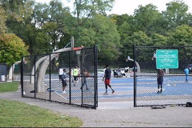 Basketball play on a nice day at Claude Evans Park, North Washington Avenue.